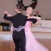 Man in black and Lady in pink gown dancing